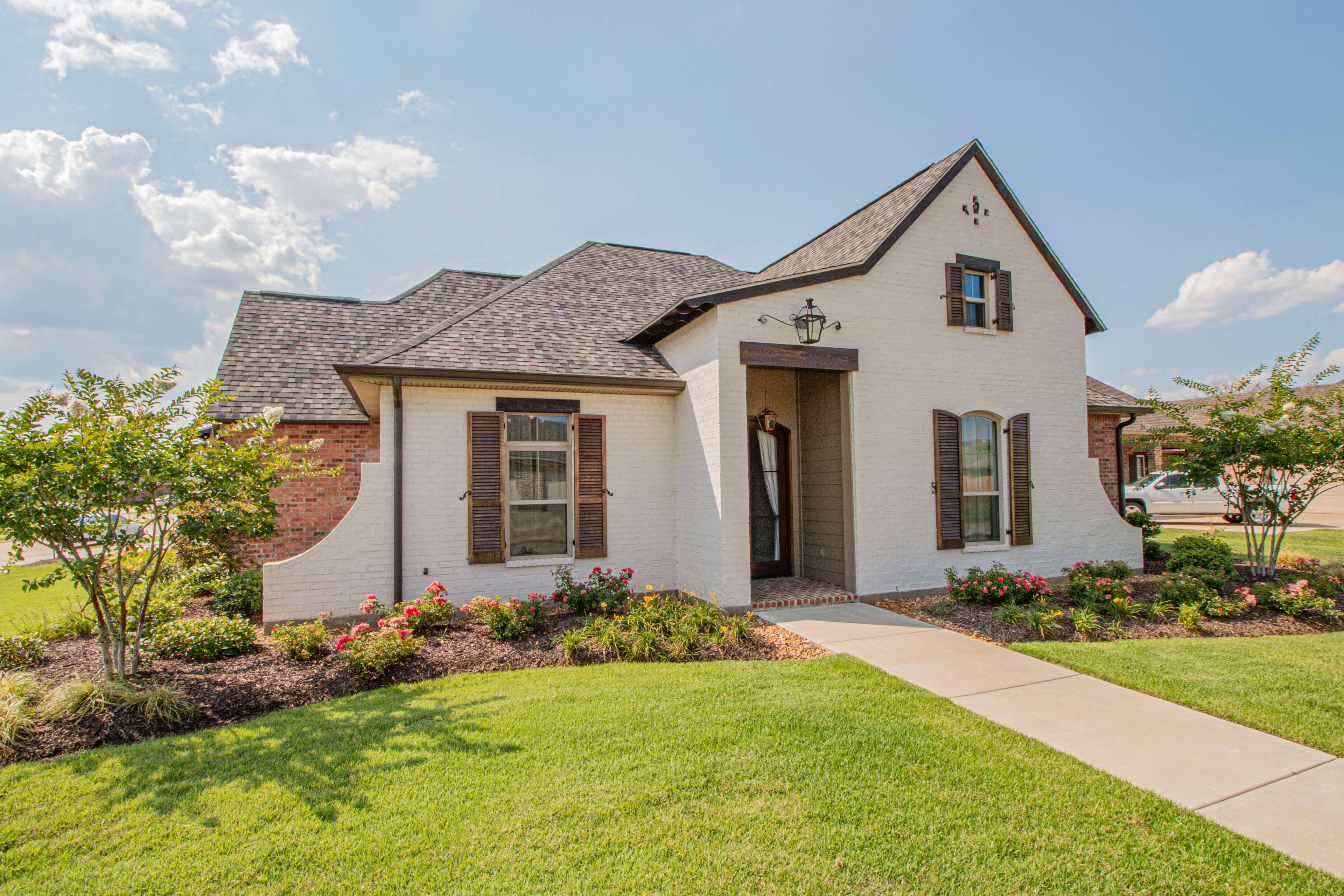 House with clean landscape and lawn.
